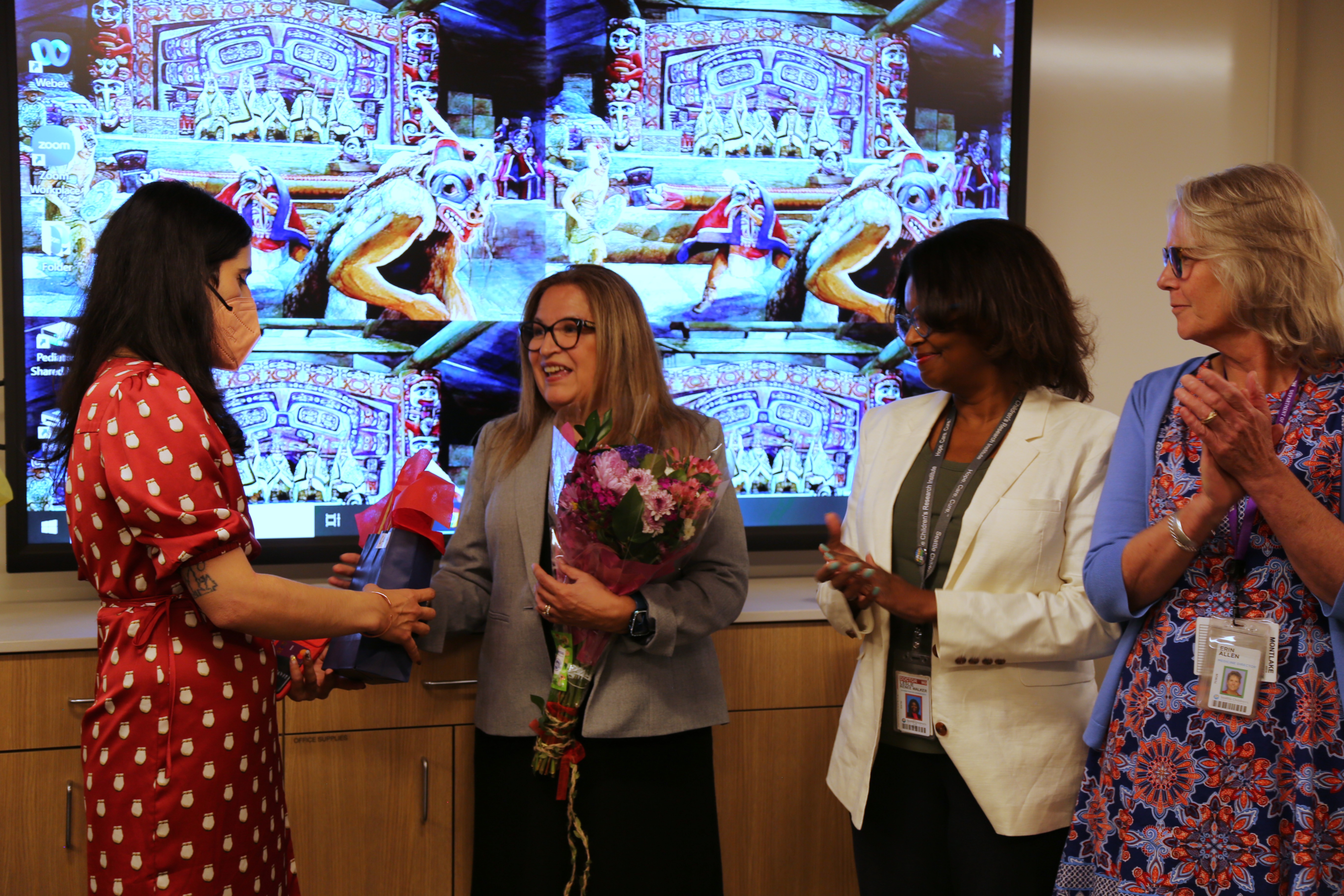 Senator Claudia Kauffman receives a gift at the CIH Open House event. 